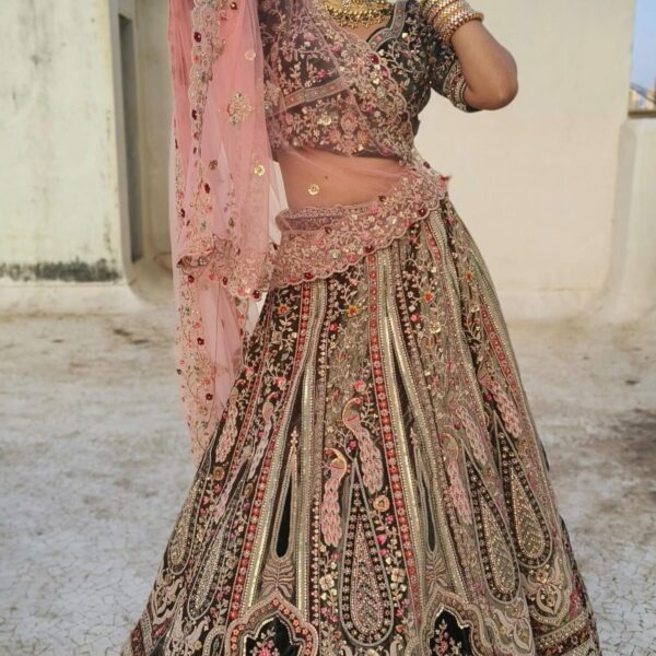 Regal Green & Pink Heavily Embroidered Lehenga <BR><BR>Rental Price: ₹8,999 (3 Days)<BR> Security Deposit: ₹9,000 (Refundable in 24 hrs)